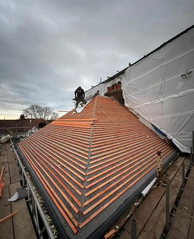 Hipped roof re-battened over new underlay, ready for tiling