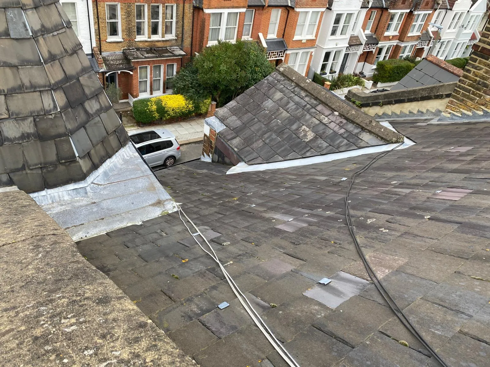 Close detail of a Victorian natural slate roof during repair