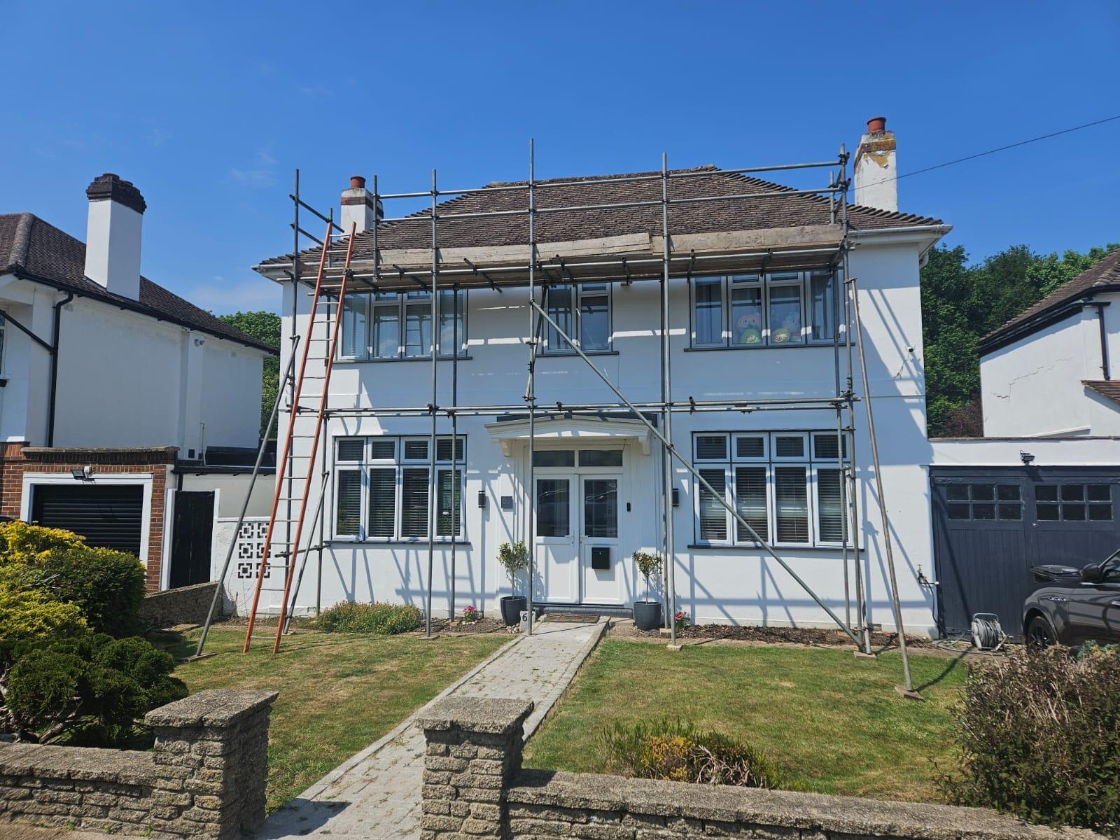 Scaffolding erected around a two-storey home before a roof replacement