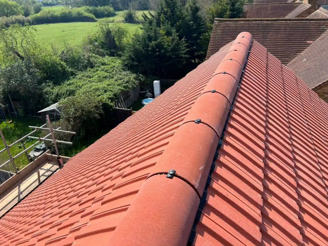 Completed terracotta-tile roof with a new dry ridge system